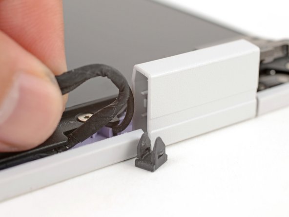 Repeat the procedure on the right hinge to release the cables.