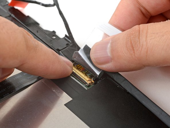 Swing the locking bar down over the connector.