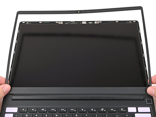 Align the bottom edge of the Bezel with the top edge of the Input Cover and press down so the Bezel covers the hinges and cables.