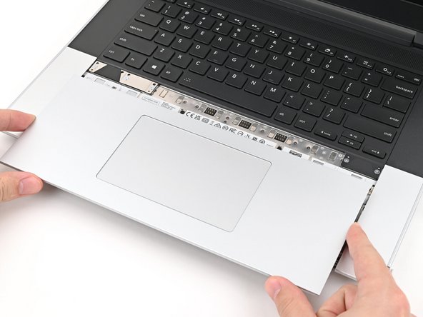 Place the Touchpad Module flat on its cutout so its clips are properly aligned.
