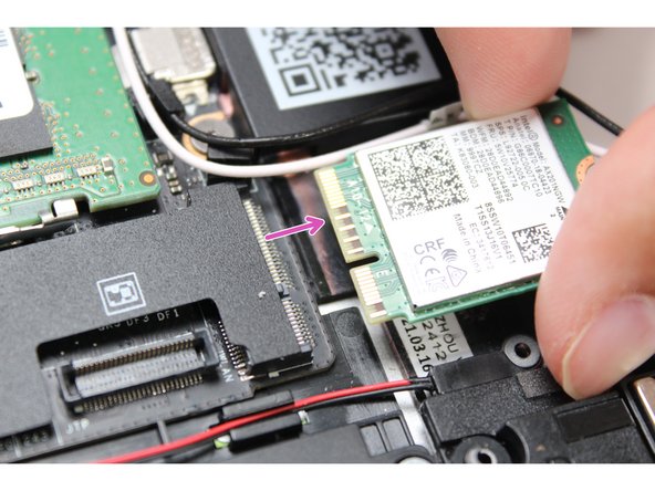 Remove the WiFi bracket and gently pull the WiFi module out of the socket as indicated in the image.