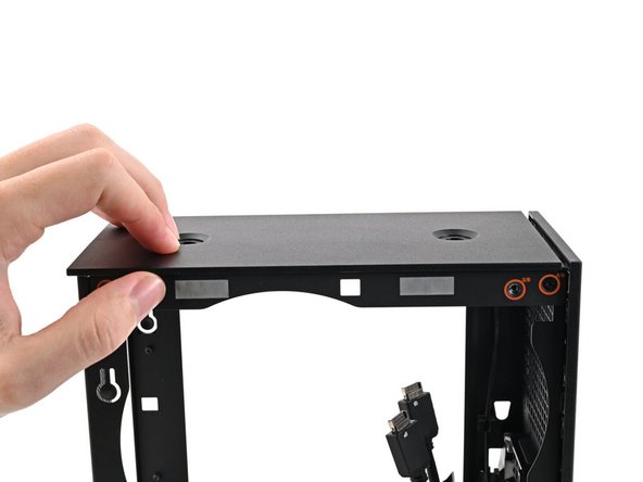If you're having a hard time gripping the Top Panel, use the screw holes to get a better handhold.