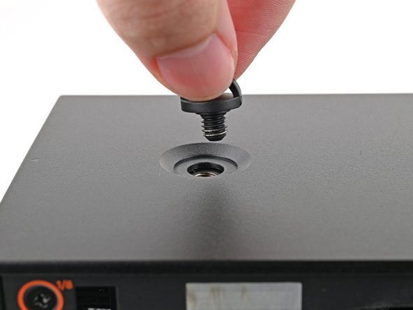 Repeat the same procedure for the other Top Panel screw.