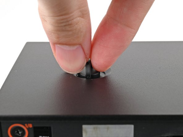 Repeat the same procedure for the other Top Panel screw.