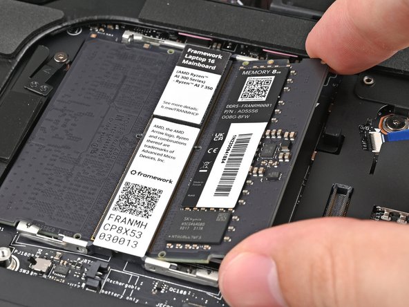 If you're using two memory modules, orient the other module so its label is facing upward and repeat the previous step for the other socket labeled DDR5 Channel 1.