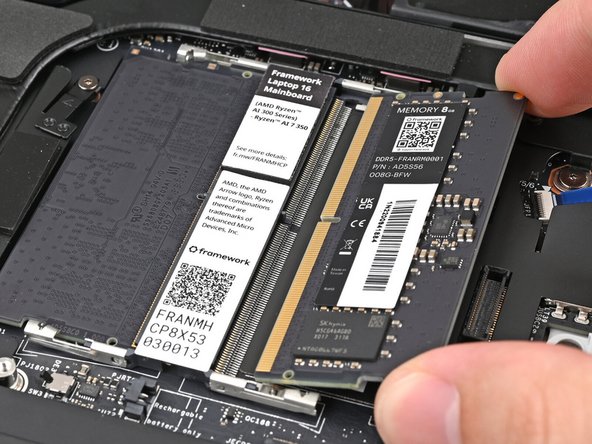 If you're using two memory modules, orient the other module so its label is facing upward and repeat the previous step for the other socket labeled DDR5 Channel 1.