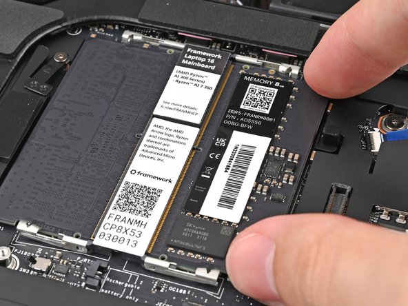 If you're using two memory modules, orient the other module so its label is facing upward and repeat the previous step for the other socket labeled DDR5 Channel 1.