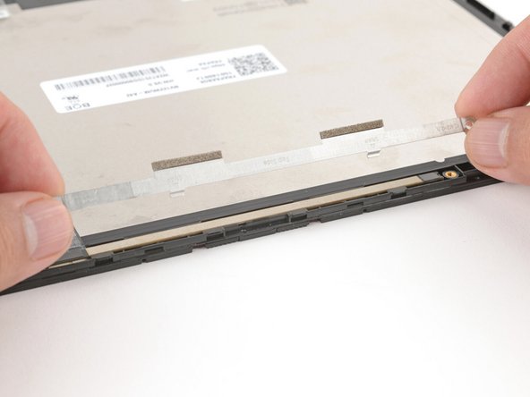 Use your fingers to align and lay the webcam bracket in place.