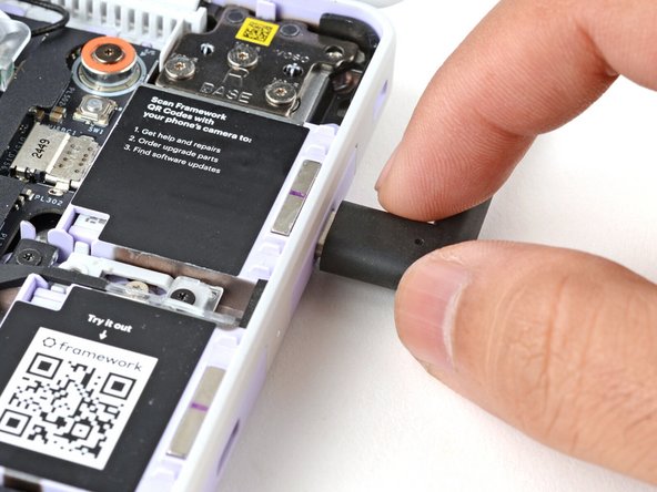 Plug the laptop into a power source using any USB-C port.