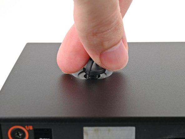 Repeat the same procedure for the other Top Panel screw.