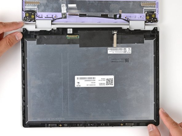 Carefully lay the display screen-side down on top of the Input Cover. The edge with the webcam should lay near the touchpad edge.