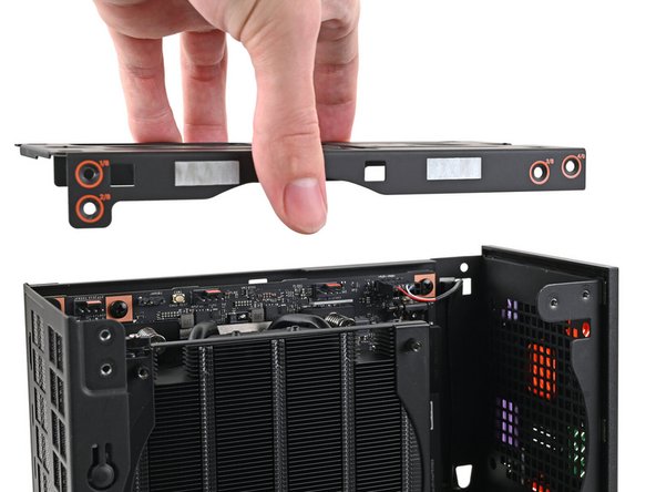 Place the top plate on top of the Desktop, making sure it slots into the chassis so the orange circles are visible.