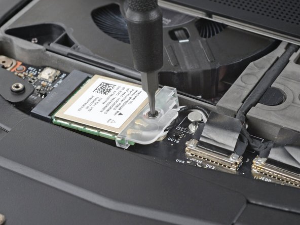 The module might pop up at a shallow angle when you loosen the screw.