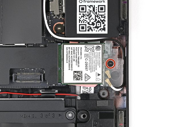 Use your Framework Screwdriver to loosen the captive T5 Torx screw securing Wi-Fi module.