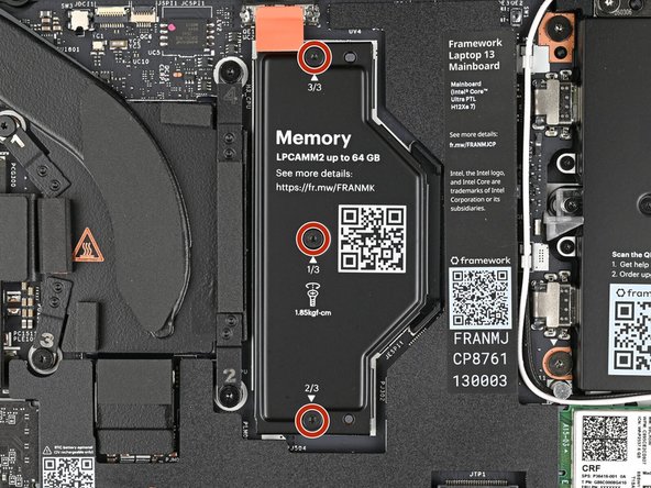 Use your Framework Screwdriver to loosen the captive T5 Torx screws securing the LPCAMM2 Memory Cover in reverse order from 3–1.
