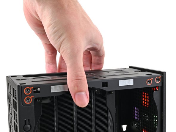 Place the top plate on top of the Desktop, making sure it slots into the chassis so the orange circles are visible.