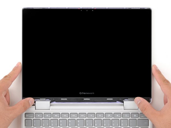 Align the display in the Top Cover such that the top edge of the display is slightly below the top edge of the Top Cover.