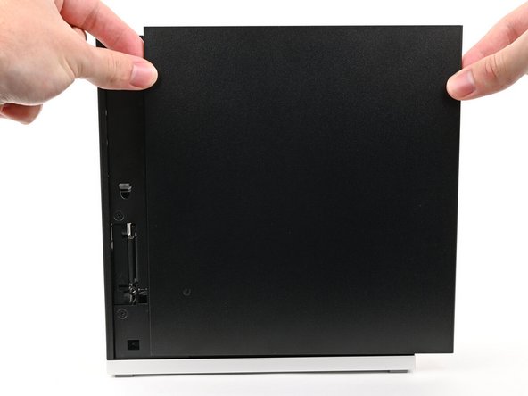 Slide the Right Panel onto the right edge of the chassis, from top to bottom, and press it flat to ensure its clips are slotted into place.