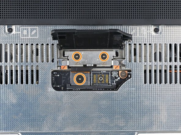 If you have the Graphics Module, use your Framework Screwdriver to tighten the four captive T5 Torx screws securing the interposer.