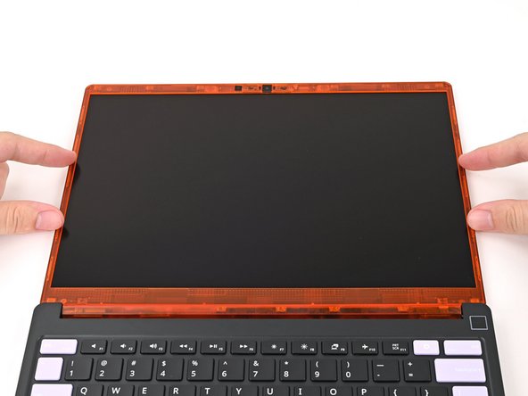 The bottom edge of the Bezel should sit flat and the magnets at its edges should "snap" into place.