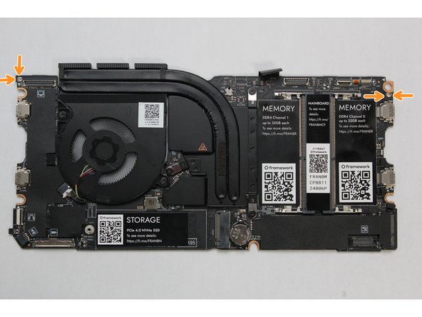The easiest way to properly install the Mainboard is by aligning the two alignment pins on the Bottom Cover with the two holes on the Mainboard.