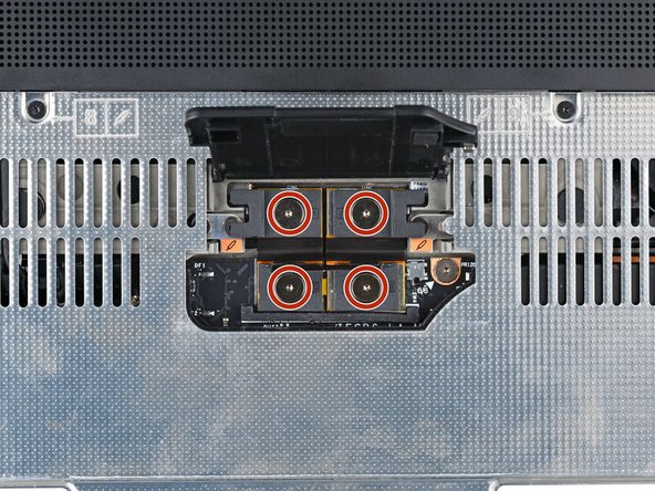If you have the Graphics Module installed, your interposer will have four screws. If you have the Expansion Bay Shell installed, you'll have three screws instead.