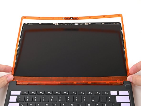 Align the bottom edge of the Bezel with the top edge of the Input Cover and press down so the Bezel covers the hinges and cables.