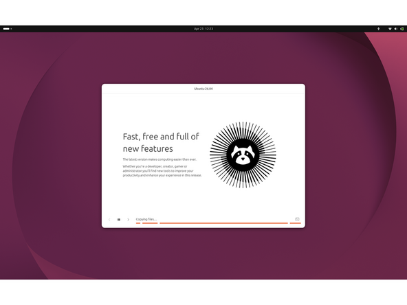 Installation runs:  The installer copies files and displays a slideshow while it works. When finished, you will be prompted to remove the USB and reboot.