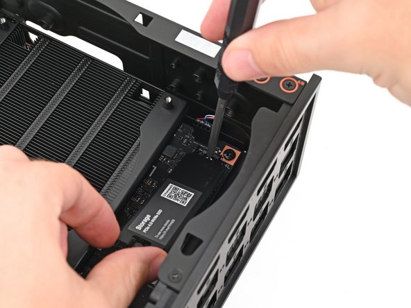 If your SSD comes with a pre-installed heat spreader, follow the next two steps. Otherwise skip to Step 11.