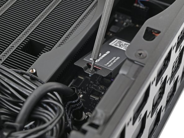 The heat spreader will pop up to an angle when its screw is fully loosened.