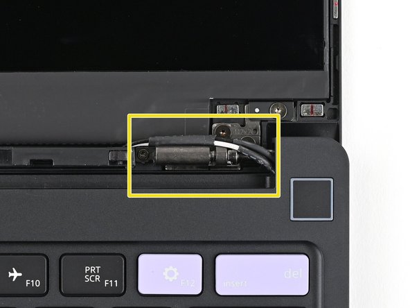 The Display Cable should be routed just above the hinge without any large gaps.