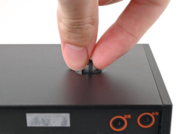 Use your fingers to twist the screw counter-clockwise and loosen it.