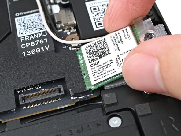 Align the Wi-Fi module's gold contacts and notch with the socket on the Mainboard.