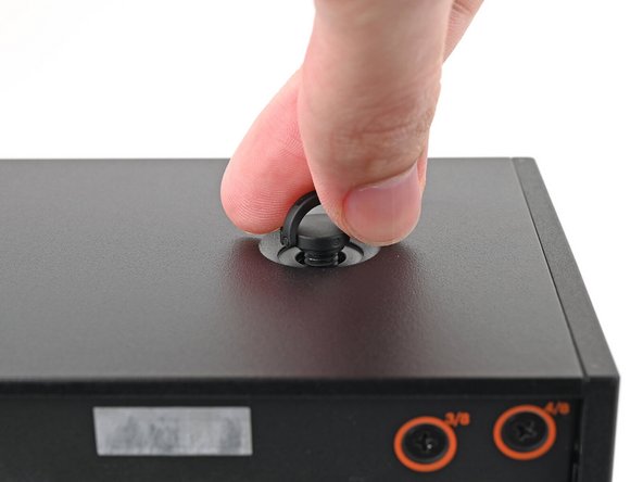 Remove the Top Panel screw.