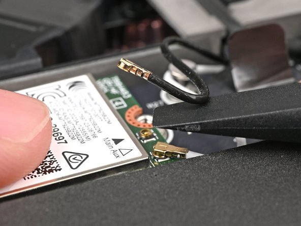 Lift the screwdriver straight up to disconnect the coaxial cable.