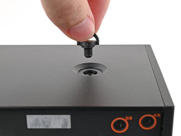 Remove the Top Panel screw.