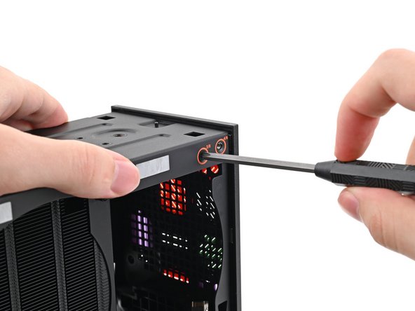 While holding the Desktop steady, use your Framework Desktop Screwdriver to install the eight 4.0 mm‑long Phillips screws securing the top plate.