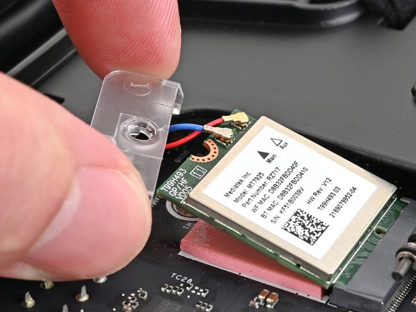 Hook the Wi-Fi bracket over the corner of the Wi-Fi module opposite the antenna cables.