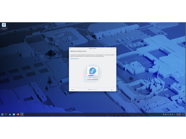Once it boots to the Live media, you will notice a box. Buttons presented are Skip and Next; ignore those  two options entirely. The large button with the Fedora logo is the one we want to pay close attention to. Click that, the screen will flash and the installer process will appear.
