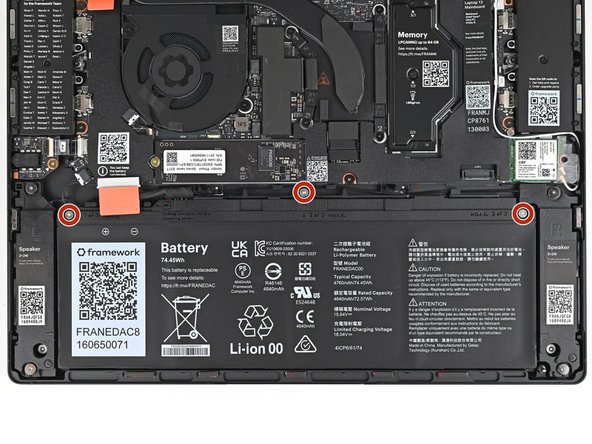 Use your Framework Screwdriver to loosen the three captive T5 Torx screws securing the Battery.