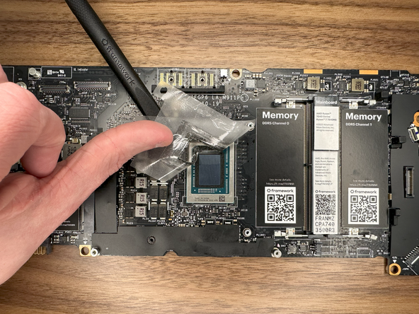 Gently peel away the clear protective tape surrounding the CPU.