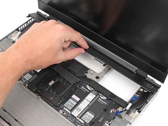 Lay the ventilation plate along the top edge of the laptop and let its magnets pull into place.