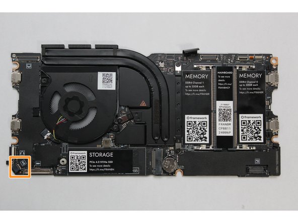 Using two fingers, slide the Speaker cable into the Mainboard using a straight motion and a slight amount of force.