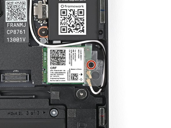 Use your Framework Screwdriver to tighten the captive T5 Torx screw securing Wi-Fi module.