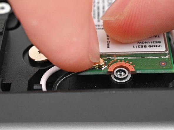 Hold the Wi-Fi module down with your finger.
