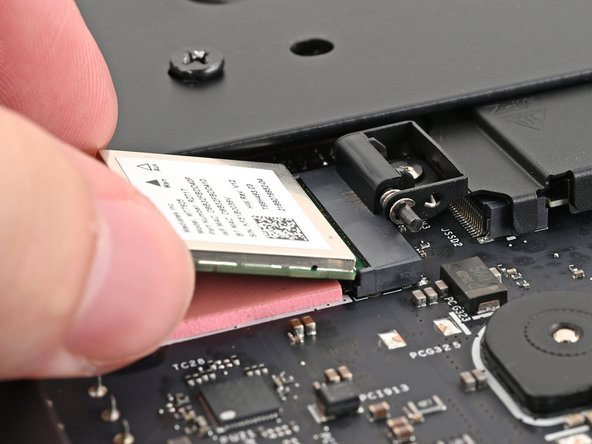 Align the Wi-Fi module's gold contacts and notch with the socket on the Mainboard.