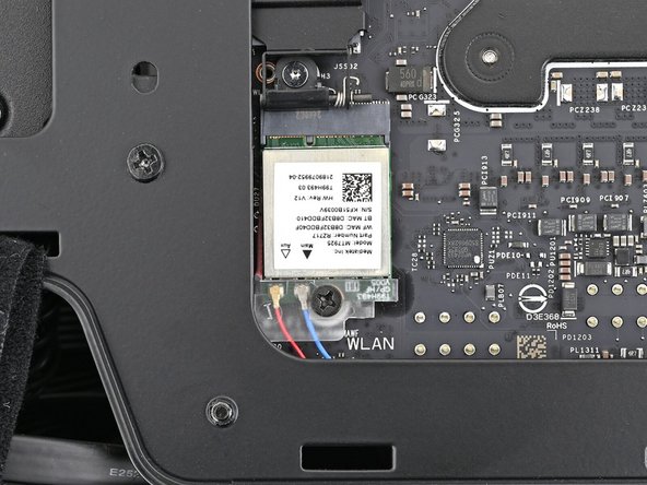 Use your Framework Desktop Screwdriver to install the 7.0 mm‑long screw securing the Wi-Fi module.