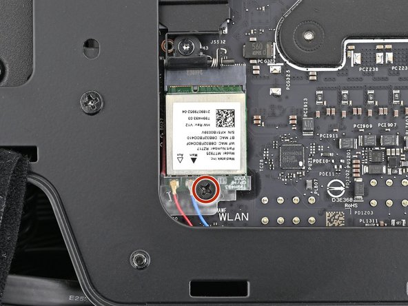 Use your Framework Desktop Screwdriver to install the 7.0 mm‑long screw securing the Wi-Fi module.