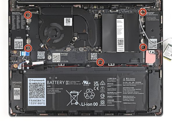 Use your Framework Screwdriver to remove the five 1.5 mm‑long T5 Torx screws securing the Mainboard.