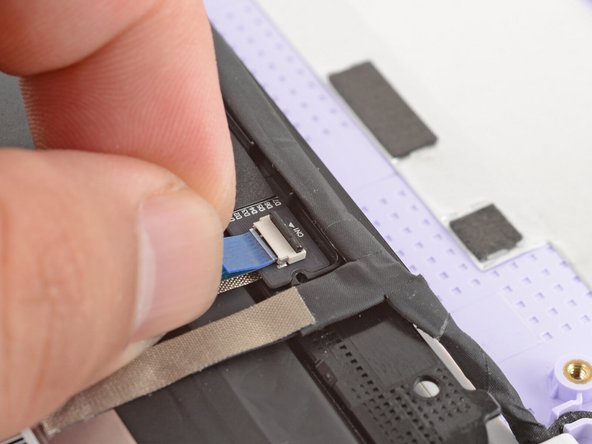 Slide the touch control cable into the ZIF connector up to the printed line on the cable.